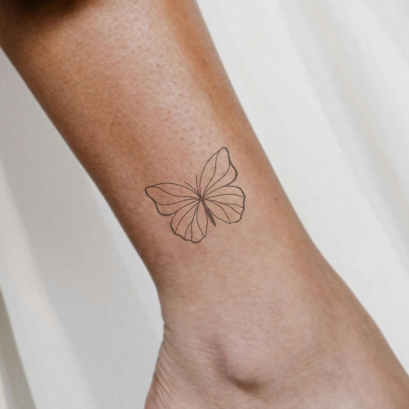 Ezra – Tatouage Papillon